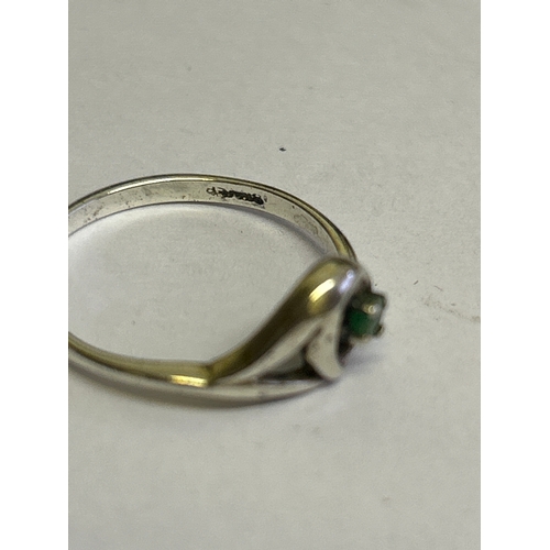 44 - Two vintage sterling silver rings, one in crossover style with 3 garnet stones hallmarked Sheffield ... 