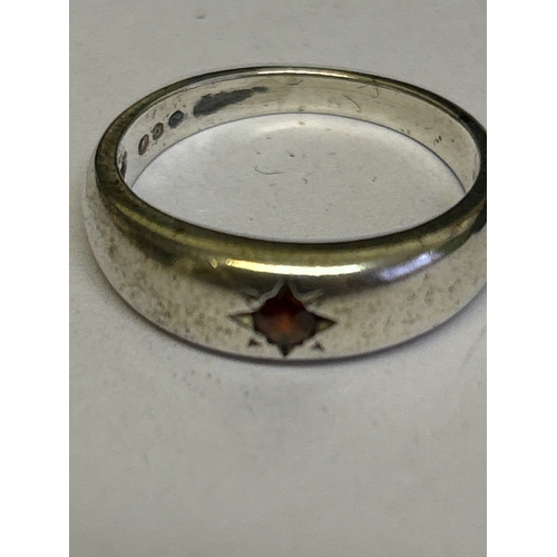45 - 3 Sterling silver vintage rings, including a flush mounted ring with garnet (size L) a crossover rin... 