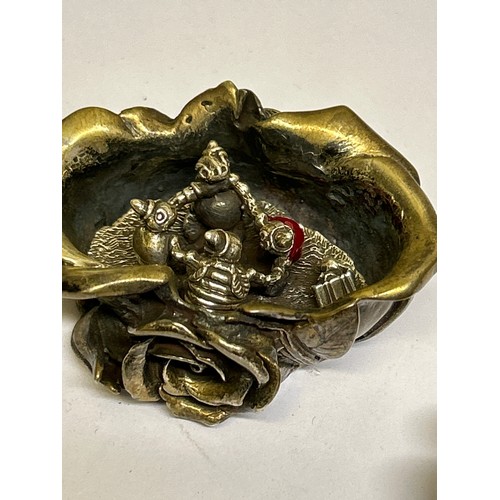 39 - A very heavy Sterling Silver lidded pot in the form of roses, the inside with a miniature group of f... 