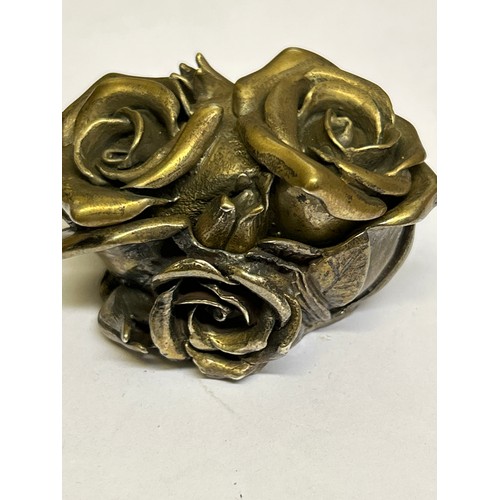 39 - A very heavy Sterling Silver lidded pot in the form of roses, the inside with a miniature group of f... 