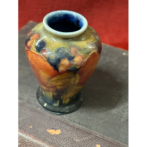 10 - An early 20th Century Moorcroft vase in the Pomegranate pattern with impressed marks “MOORCROFT ENGL... 