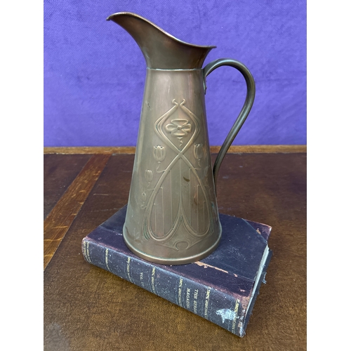 2 - An Edwardian copper jug with embossed Art Nouveau design, by Joseph Sankey, Wolverhampton. 30cm