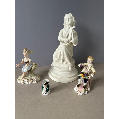 171 - Derby and Royal Crown Derby four pieces to include:- blanc de chine figurine of a child with a lyre,... 