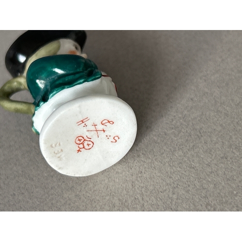 171 - Derby and Royal Crown Derby four pieces to include:- blanc de chine figurine of a child with a lyre,... 