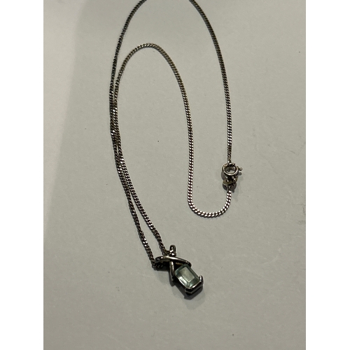 95 - A sterling silver cross style pendant on chain, set with a square cut aquamarine stone. Both pendant... 