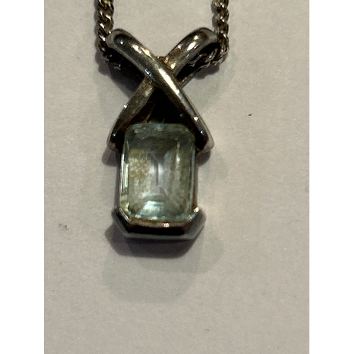 95 - A sterling silver cross style pendant on chain, set with a square cut aquamarine stone. Both pendant... 