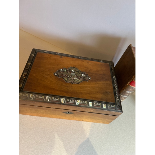312A - A mid 19th Century ladies walnut work box with a marquetry panel to the lid depicting a basket of fl... 