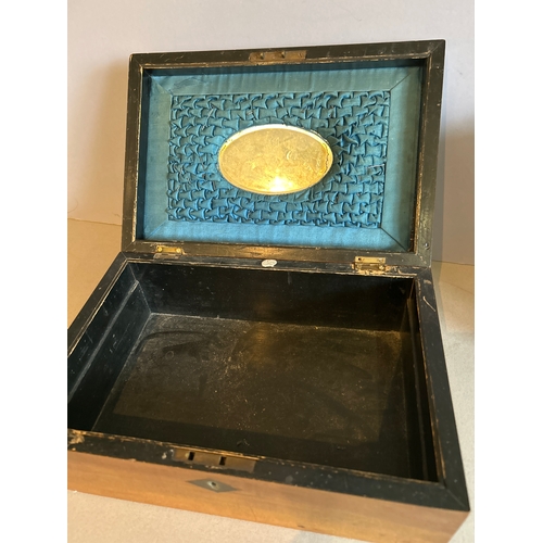 312A - A mid 19th Century ladies walnut work box with a marquetry panel to the lid depicting a basket of fl... 