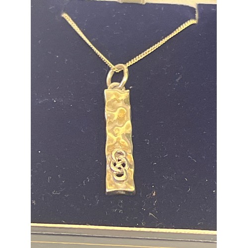 28 - 2 SOLID SILVER PENDANTS OF CELTIC DESIGNS ON SILVER CHAINS