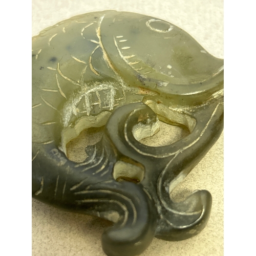 102 - Two pieces of carved jade including a horse snd a carp fish