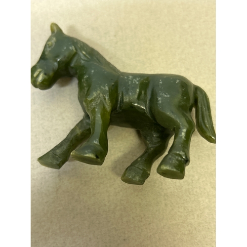 102 - Two pieces of carved jade including a horse snd a carp fish
