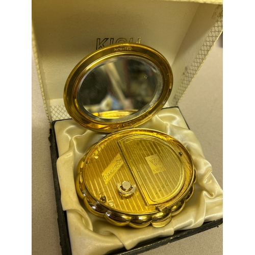 143 - A vintage Kigu “Concerto” musical compact, the cobalt blue lid with marcasite bow. Original box.