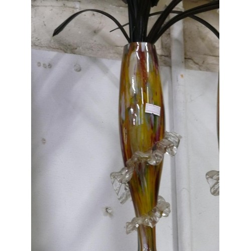 67 - Pair of multi coloured glass vases with a spiral frill design  and faux White flowers
