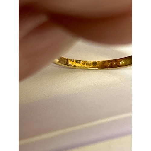 119 - A 9ct gold wishbone ring set with cubic zirconia and garnets. Size M , 1.3 grams