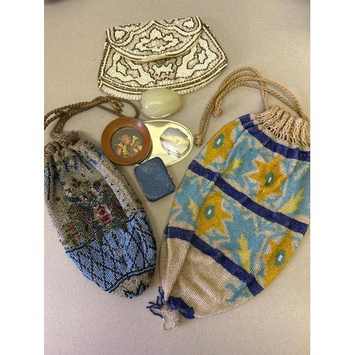 117 - A decorative lot to include Edwardian & 1920’s beadwork evening bags, a sterling silver pill box, a ... 