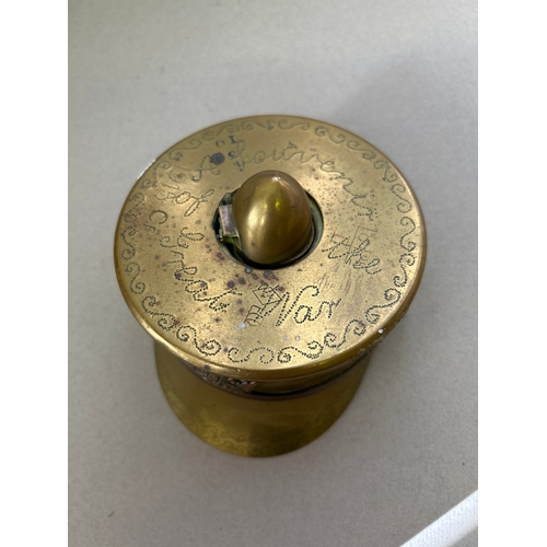 128 - A good WW1 trench art officers cap inkwell, with Canadian cap badge, punched decoration & inscriptio... 