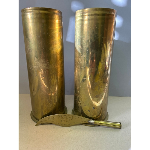 129 - Two WW1 trench art shell case vases dated 1917 and a bullet handled paper knife with punched inscrip... 