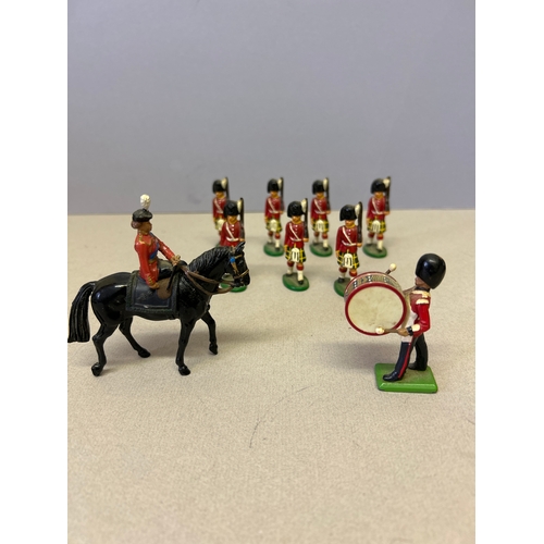 130 - Queen Elizabeth II on horseback and bandsmen handpainted model figures, probably all Britains but on... 
