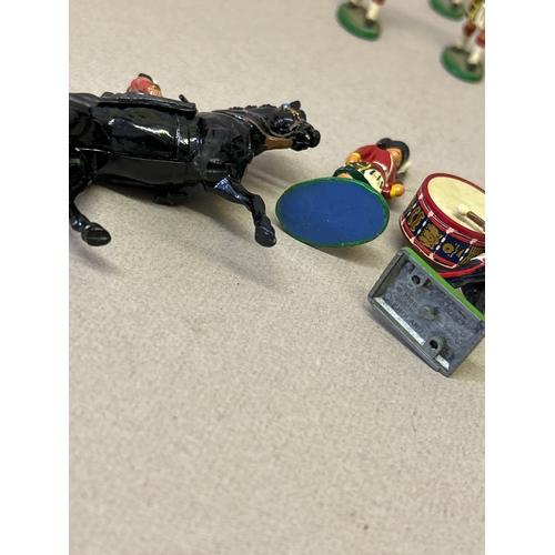 130 - Queen Elizabeth II on horseback and bandsmen handpainted model figures, probably all Britains but on... 