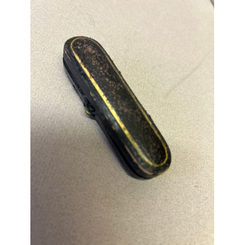 123 - An amber cheroot holder with a 9ct gold tip hallmarked London 1922 with original leather case.