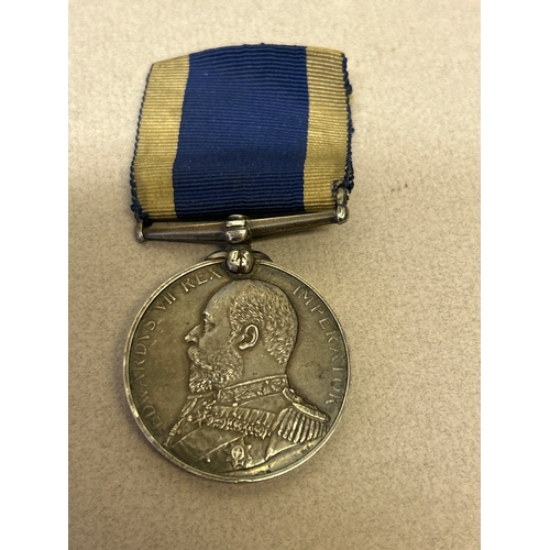 132 - An Edward VII silver naval Long Service & Good Conduct Medal awarded to S W Oliver, SH.COOK. H.M.S. ... 