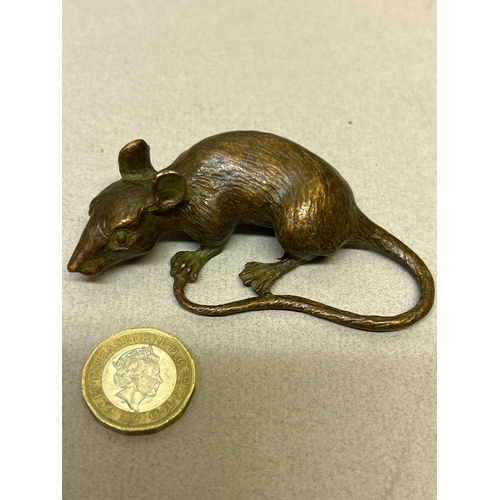 122 - A Japanese bronze sculpture of a rat, signed to the belly. 8cm