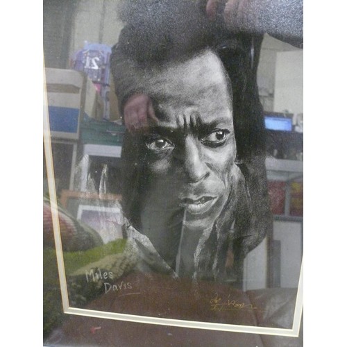 63 - 2 framed and glazed prints of Miles Davies and Charlie Parker