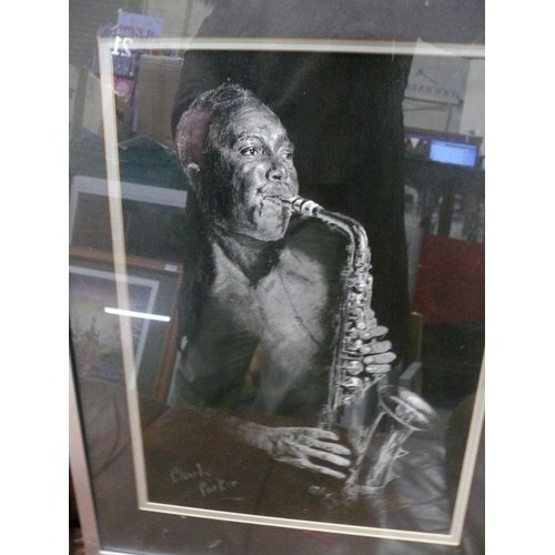 63 - 2 framed and glazed prints of Miles Davies and Charlie Parker