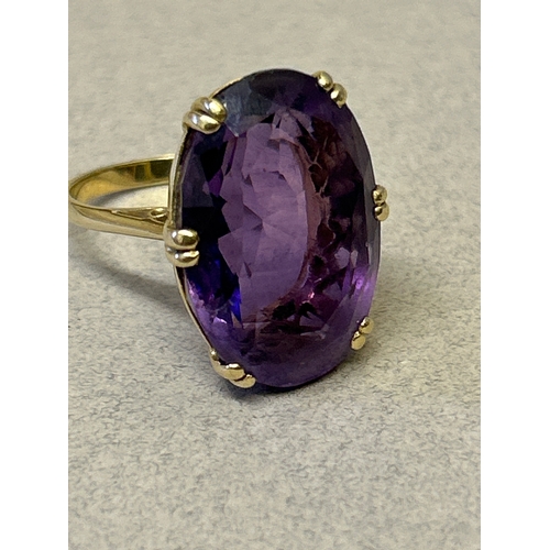 116 - A vintage 18ct gold ring set with a large oval amethyst. Stone size 21mm x 15mm. Ring size N, weight... 