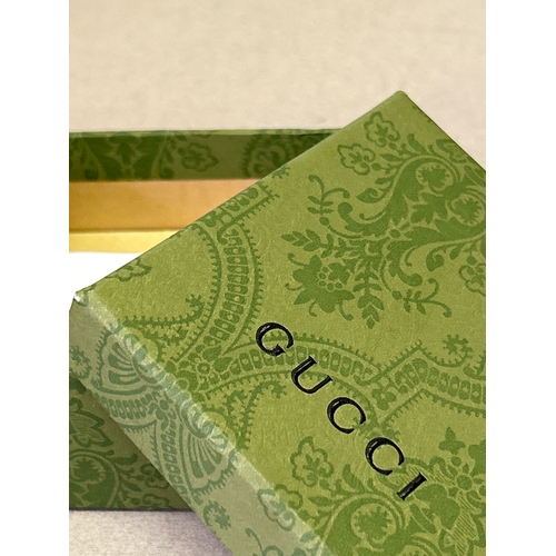 47A - Gucci. Designer double G necklace and matching earring set with large oval cut white crystals and wi... 