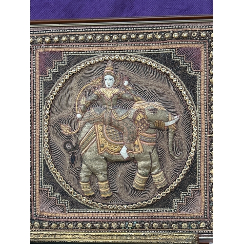 233 - A beautiful 20th Century Burmese Kalaga tapestry of a figure on an elephant- hand embroidered with g... 