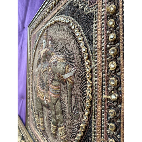 233 - A beautiful 20th Century Burmese Kalaga tapestry of a figure on an elephant- hand embroidered with g... 