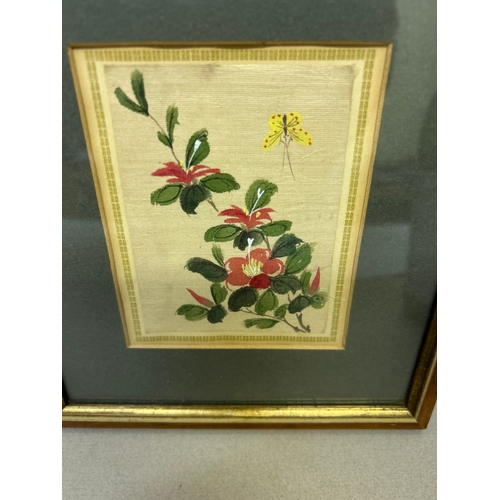 249 - Three early 20th Century Japanese paintings on silk,  depicting flowers, bird and fish. One has crac... 