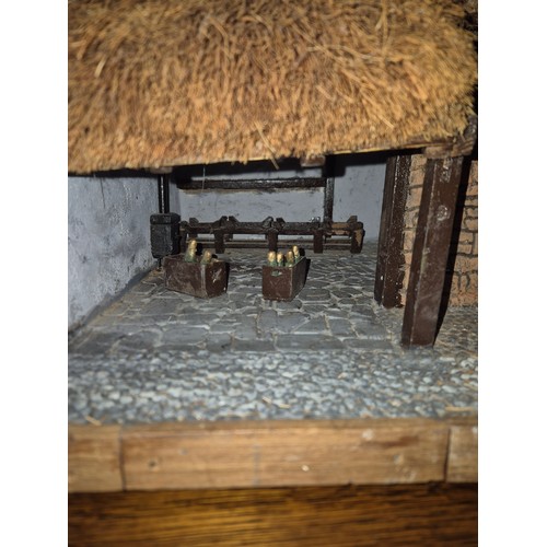 331 - A large and impressive scratch built diorama of a thatched Hop barn or Malt house. The end wall is r... 