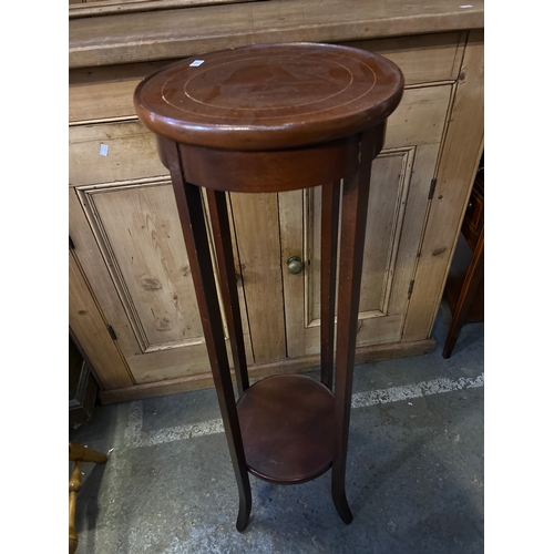 594 - An Edwardian style mahogany plant stand with boxwood stringing to the top, the four square legs join... 