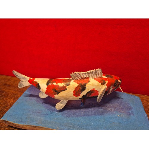 338 - Hand carved and painted Koi Carp model on heavy wooden base.