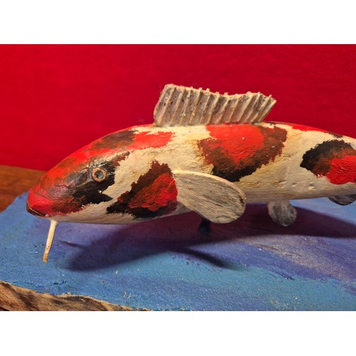 338 - Hand carved and painted Koi Carp model on heavy wooden base.