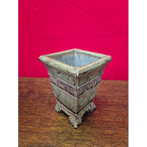 365 - A vintage ceramic garden planter or urn, with a distressed, crackle-glaze finish in a pale green col... 