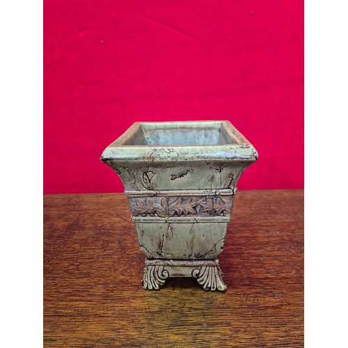 365 - A vintage ceramic garden planter or urn, with a distressed, crackle-glaze finish in a pale green col... 