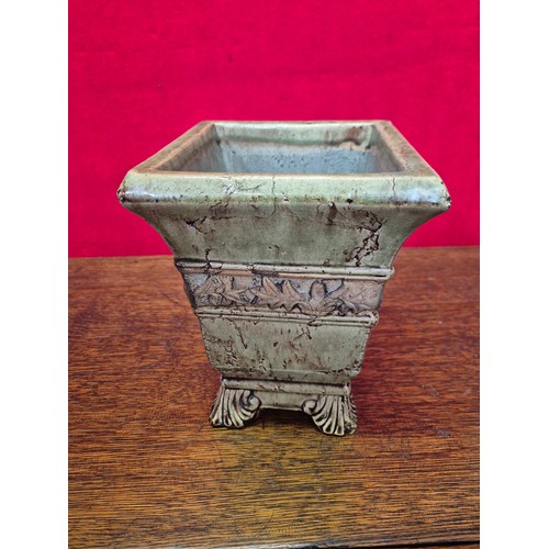 365 - A vintage ceramic garden planter or urn, with a distressed, crackle-glaze finish in a pale green col... 