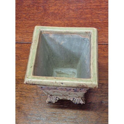 365 - A vintage ceramic garden planter or urn, with a distressed, crackle-glaze finish in a pale green col... 