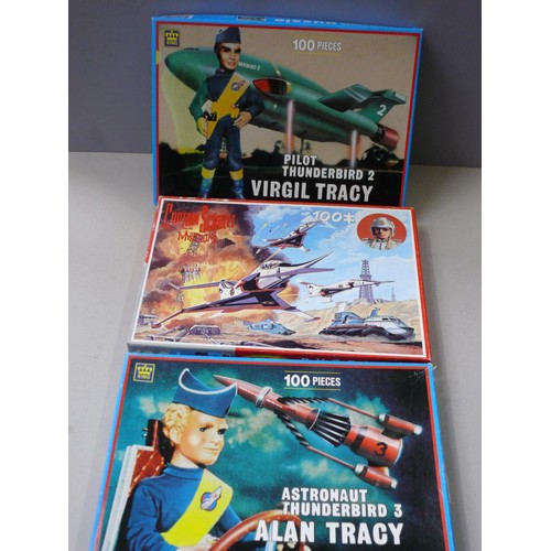 499 - Thunderbirds and Captain Scarlet vintage jigsaws in boxes. Three 100 piece jigsaws made by King, inc... 