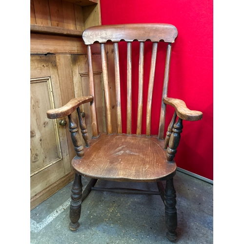 668 - A Victorian grandfather kitchen chair with elm seat, nicely shaped back rail & arms