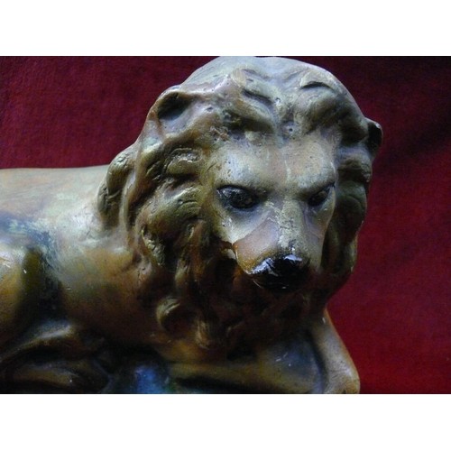 397 - Early 20thC carnival chalkware statue of a recumbent lion. Approx 24cm tall.