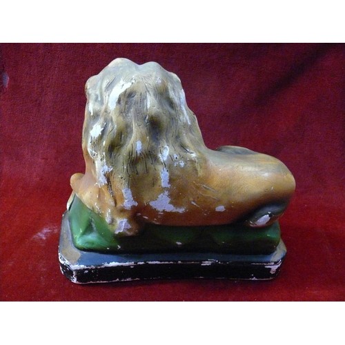 397 - Early 20thC carnival chalkware statue of a recumbent lion. Approx 24cm tall.