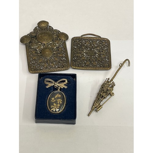 67M - A bronze belt buckle, early 20th century, a brooch of flowers and a lovely parasol in filigree work.