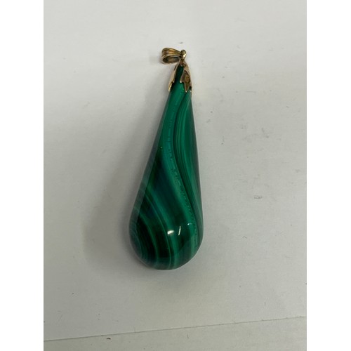 67D - A natural malachite tear drop pendant with 14ct gold fittings.