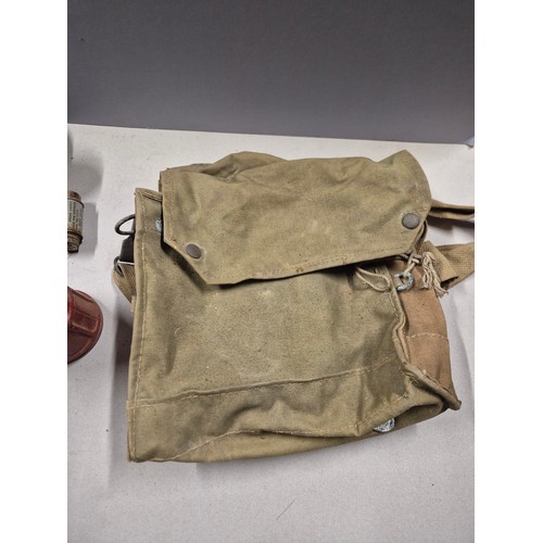 552 - WWII British issue gas mask. Model No.4 Mk.III gas mask, dated 1941 on headstrap. Complete with hose... 
