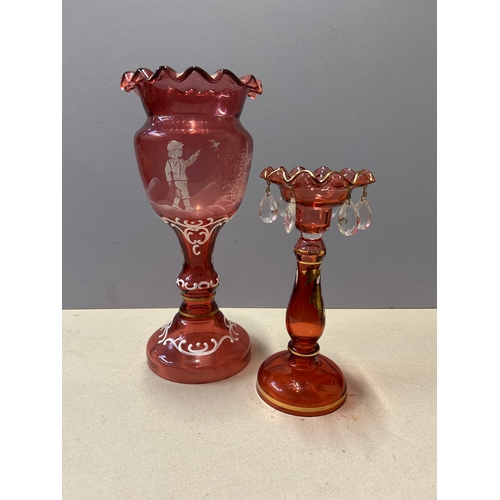 147 - A Victorian style Cranberry Glass decorative vase with Mary Gregory type enamel decoration of a boy ... 