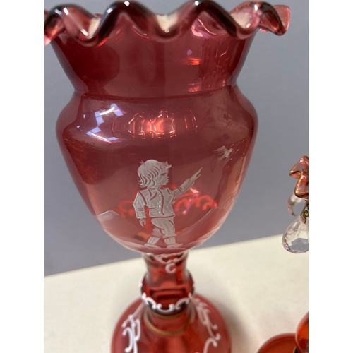 147 - A Victorian style Cranberry Glass decorative vase with Mary Gregory type enamel decoration of a boy ... 